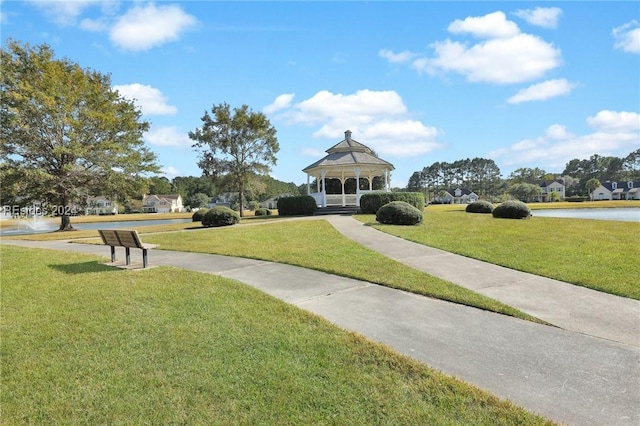 surrounding community with a gazebo and a lawn