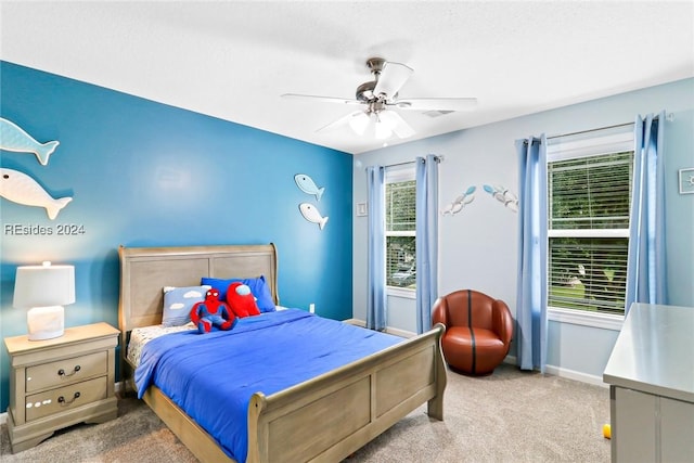 carpeted bedroom with ceiling fan