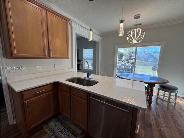 kitchen featuring dishwasher, sink, hanging light fixtures, kitchen peninsula, and a textured ceiling