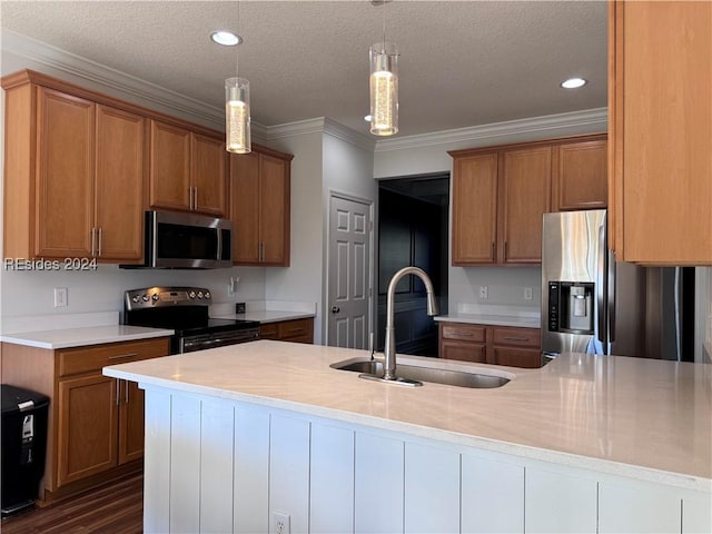 kitchen with sink, decorative light fixtures, a textured ceiling, ornamental molding, and stainless steel appliances