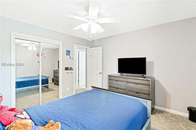 bedroom with light carpet, a closet, and ceiling fan