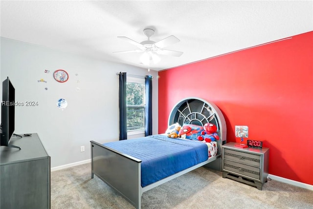 carpeted bedroom with ceiling fan