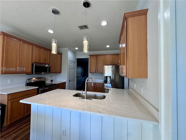 kitchen with sink, crown molding, decorative light fixtures, a textured ceiling, and stainless steel appliances