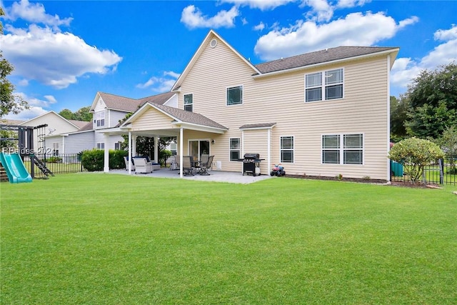 back of property with a playground, a patio, a yard, and a pergola