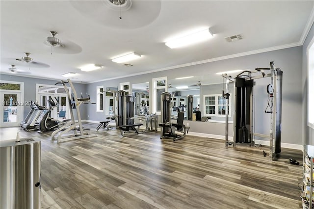 gym with hardwood / wood-style flooring, ornamental molding, and ceiling fan