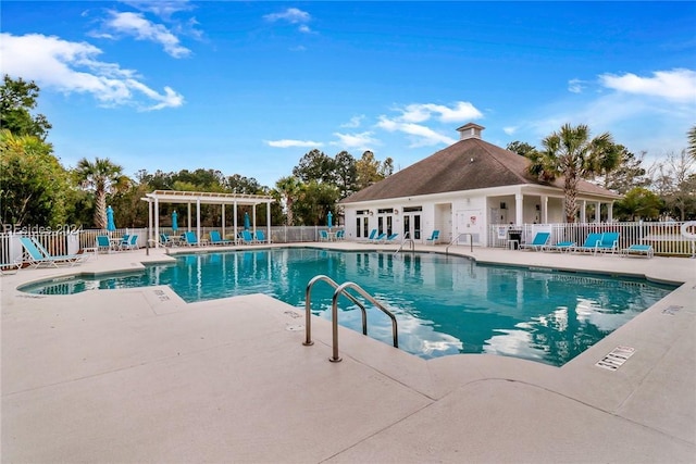 view of swimming pool featuring a pergola and a patio