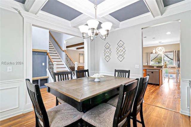 dining space featuring coffered ceiling, a notable chandelier, crown molding, and beamed ceiling