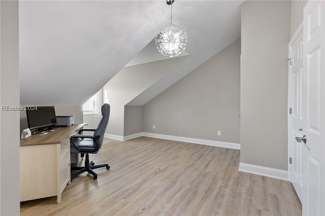 office featuring vaulted ceiling, a chandelier, and light hardwood / wood-style flooring