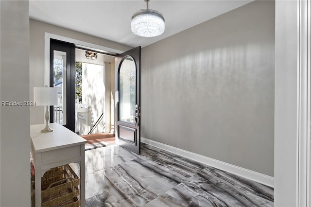 entrance foyer with a notable chandelier