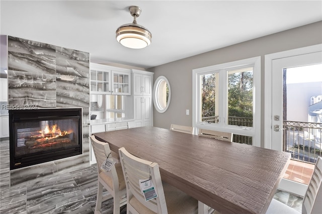 dining room with a tiled fireplace