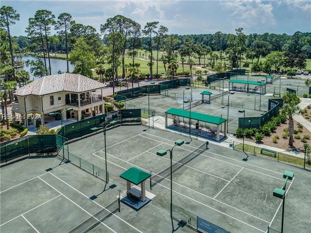 birds eye view of property with a water view