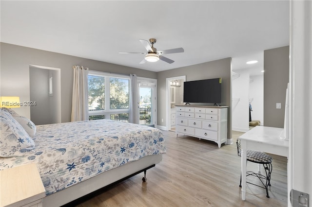 bedroom with ensuite bathroom, ceiling fan, and light hardwood / wood-style floors