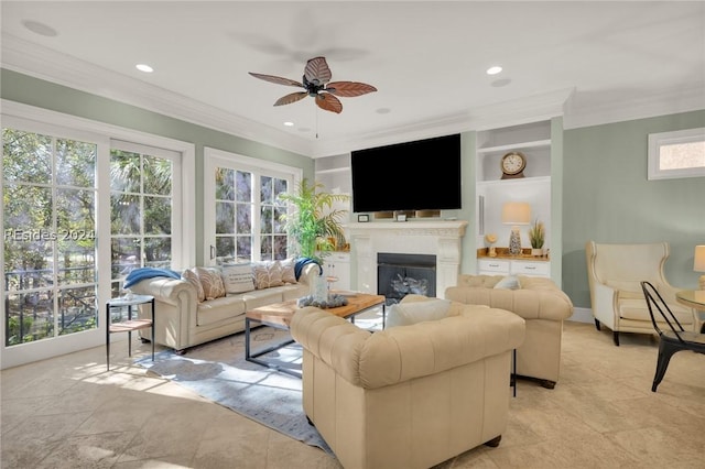 living room featuring crown molding, built in shelves, and ceiling fan