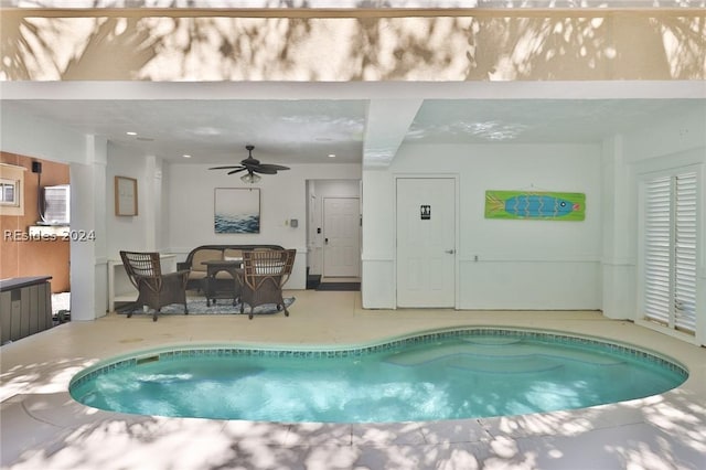 view of pool featuring ceiling fan