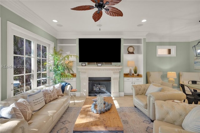 living room featuring crown molding, ceiling fan, and built in shelves