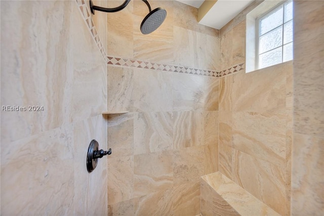 room details featuring a tile shower