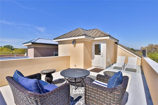 view of patio featuring a balcony