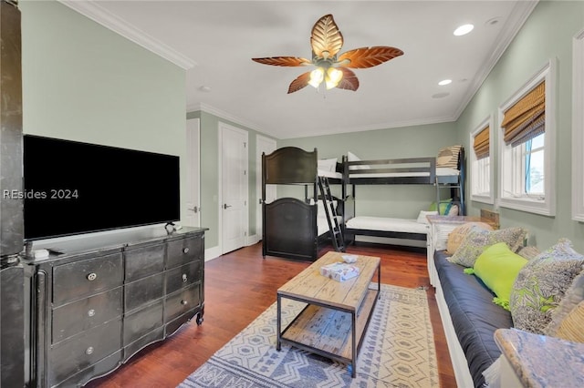 bedroom featuring ornamental molding, dark wood-type flooring, and ceiling fan