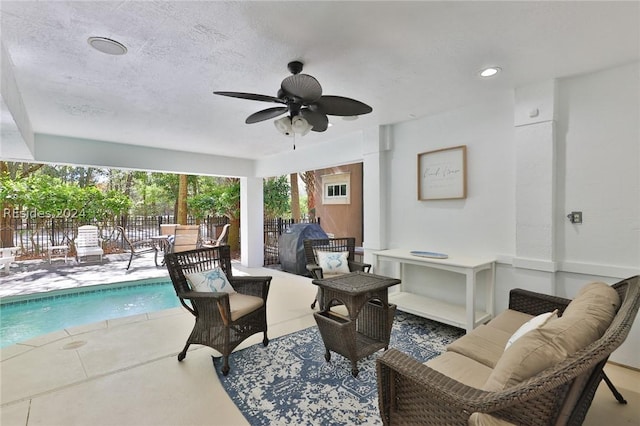 exterior space with ceiling fan