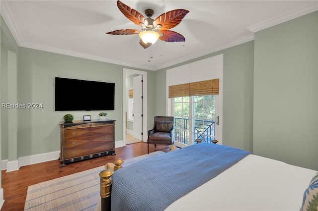 bedroom with crown molding, ceiling fan, connected bathroom, and hardwood / wood-style flooring