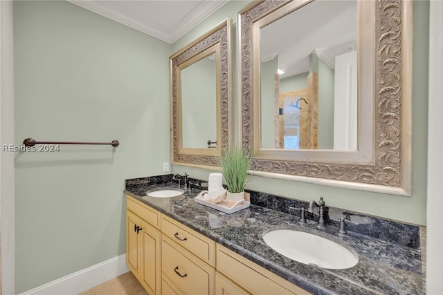 bathroom with crown molding and vanity