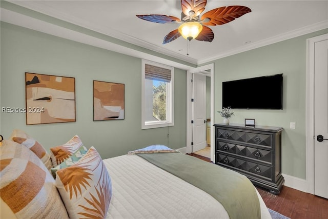 bedroom featuring ornamental molding, wood-type flooring, and ceiling fan