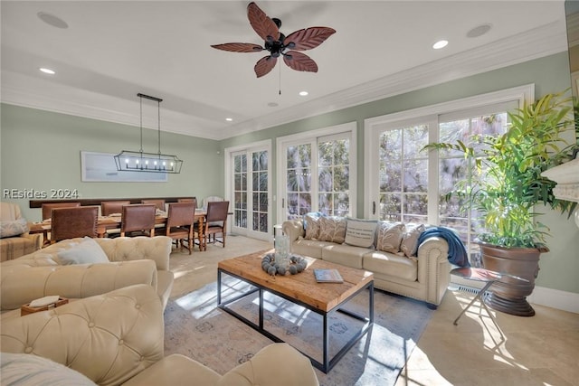 living room with crown molding and ceiling fan with notable chandelier