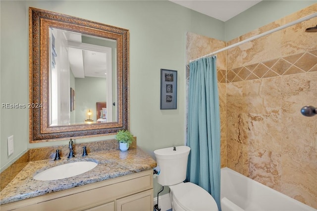 full bathroom featuring vanity, shower / bath combination with curtain, and toilet