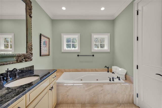 bathroom featuring crown molding, vanity, and tiled bath