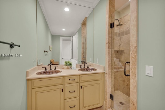 bathroom with vanity, crown molding, and walk in shower