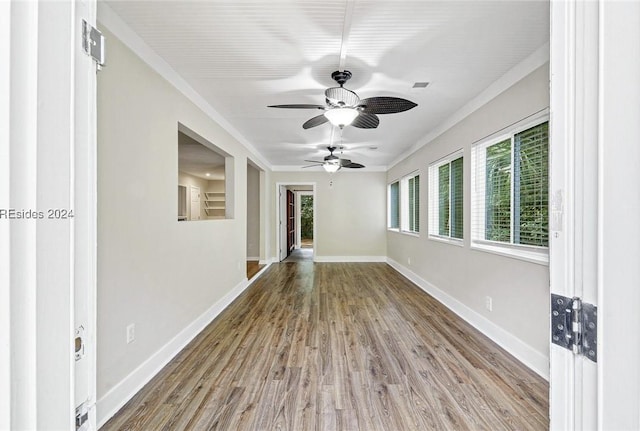 spare room featuring crown molding, ceiling fan, and hardwood / wood-style floors