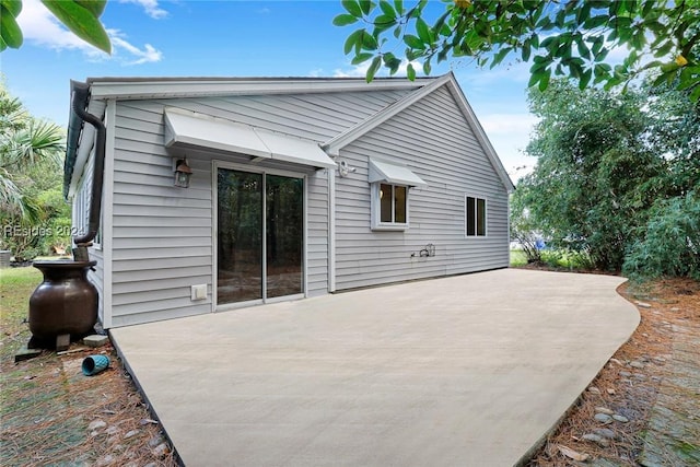 rear view of house featuring a patio