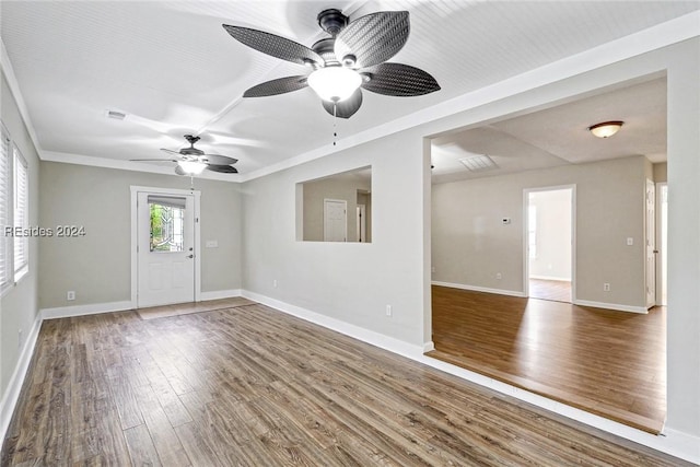 unfurnished room with hardwood / wood-style floors and ceiling fan