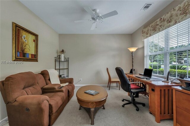 office space with light colored carpet and ceiling fan