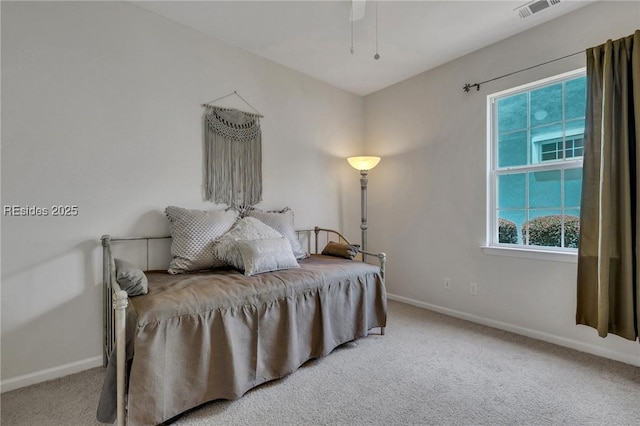 bedroom with ceiling fan and carpet floors