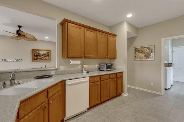 kitchen with sink, washer / dryer, dishwasher, and ceiling fan