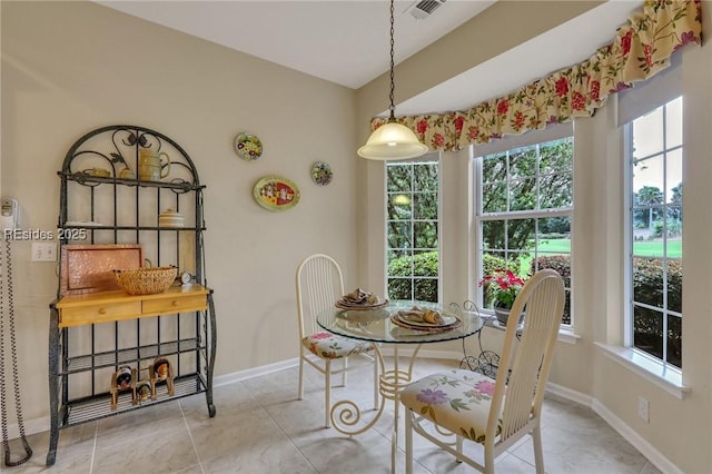 dining space with light tile patterned flooring