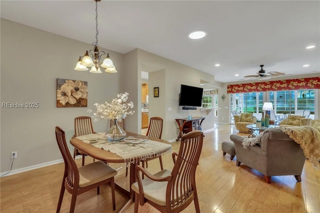 dining room with ceiling fan and light hardwood / wood-style floors