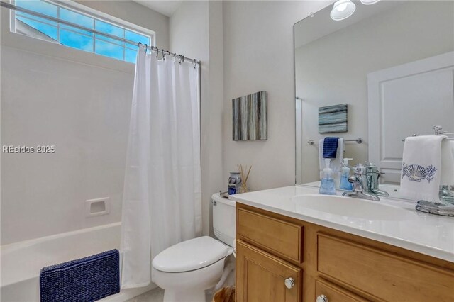 full bathroom featuring vanity, toilet, and shower / bath combo with shower curtain