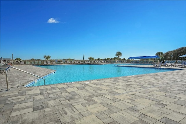 view of swimming pool with a patio