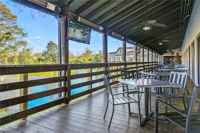 exterior space featuring a water view and ceiling fan