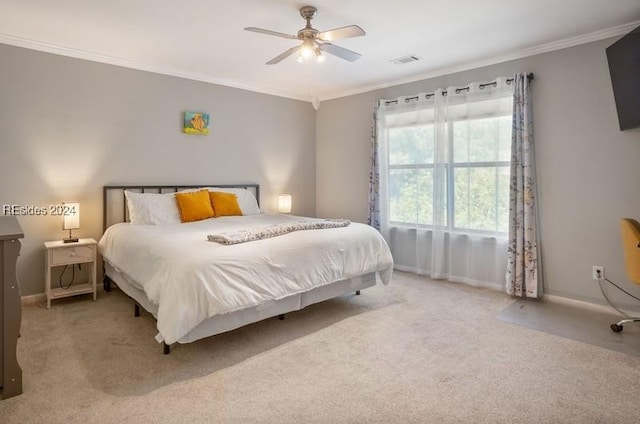 bedroom with light carpet, crown molding, and ceiling fan