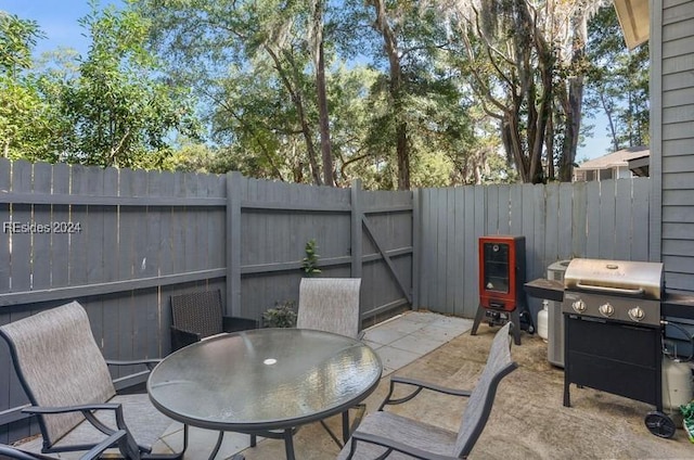 view of patio featuring a grill