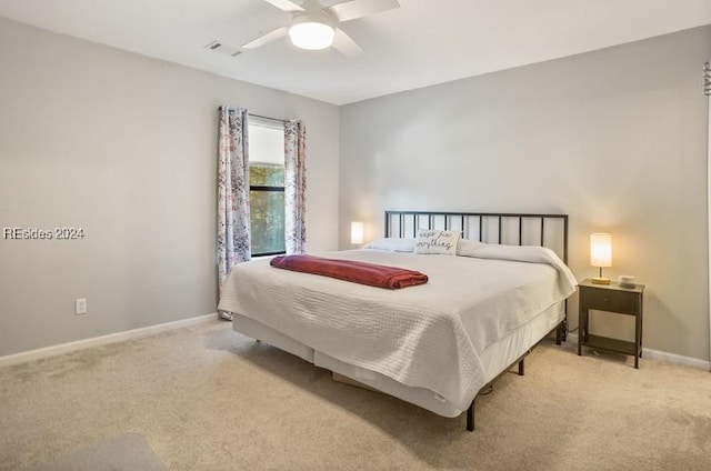 carpeted bedroom featuring ceiling fan