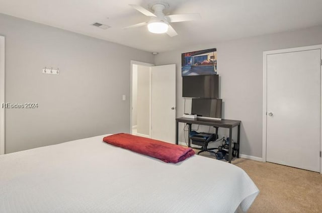 carpeted bedroom with ceiling fan