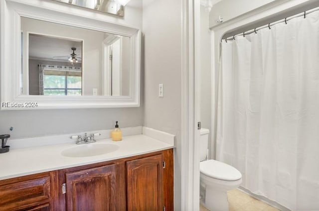 bathroom featuring vanity, ceiling fan, and toilet