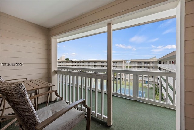 balcony featuring a water view