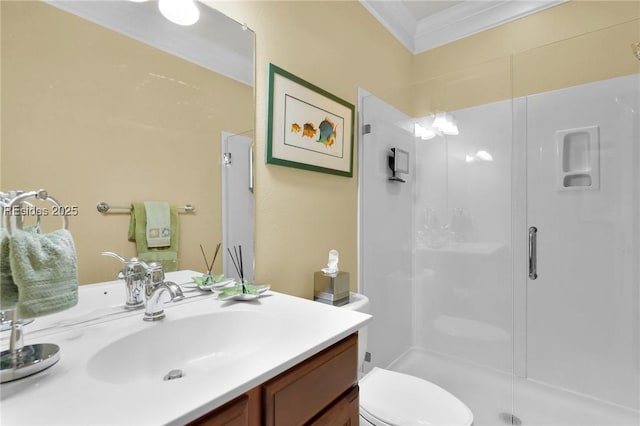 bathroom with crown molding, vanity, toilet, and an enclosed shower