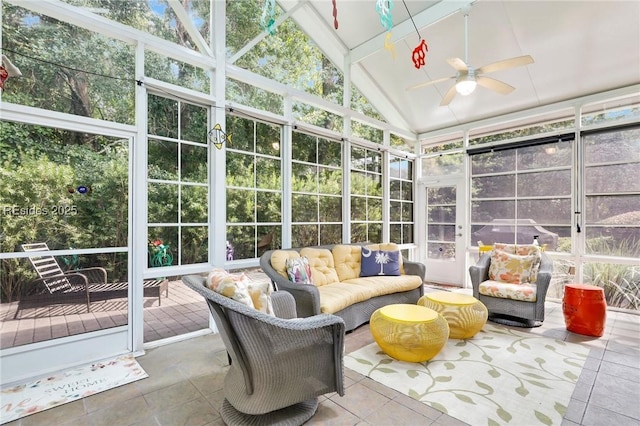 sunroom featuring lofted ceiling and ceiling fan