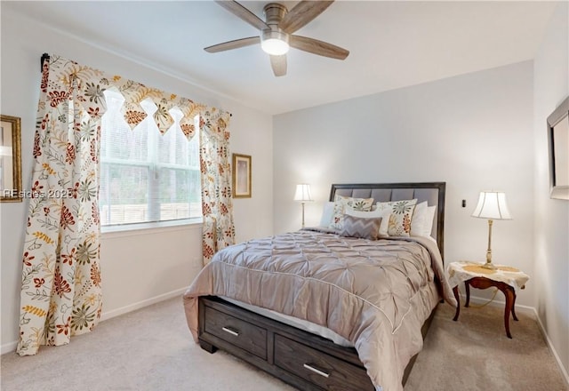 bedroom featuring light carpet and ceiling fan